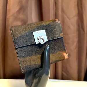 Salvatore Ferragamo wallet with cow hide. Slight rubbing on two corners.